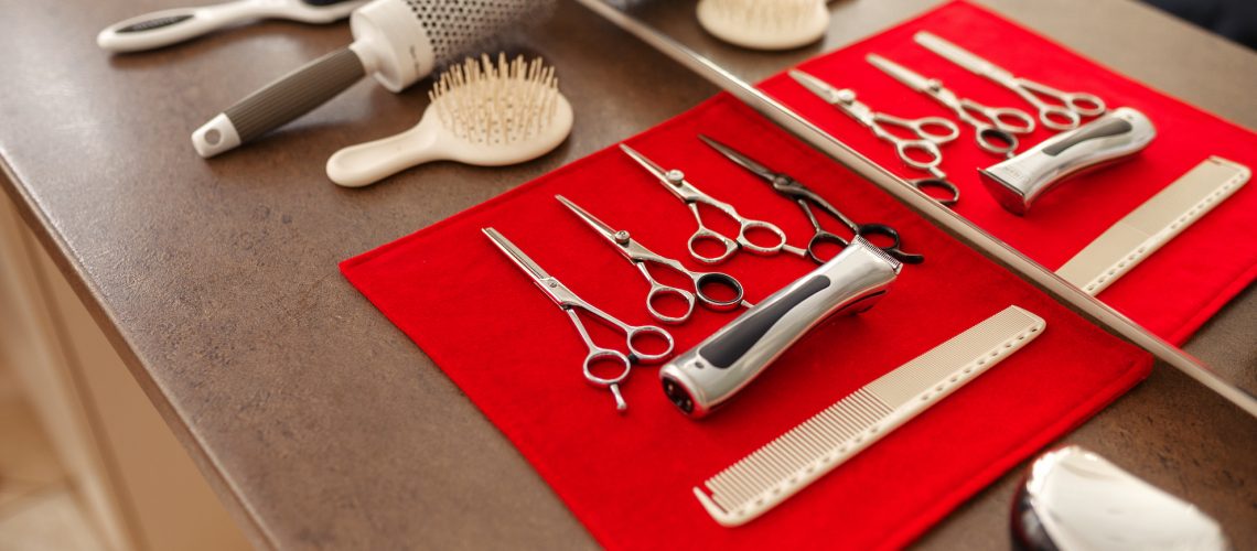 Hairdresser equipment on table, hairdressing salon
