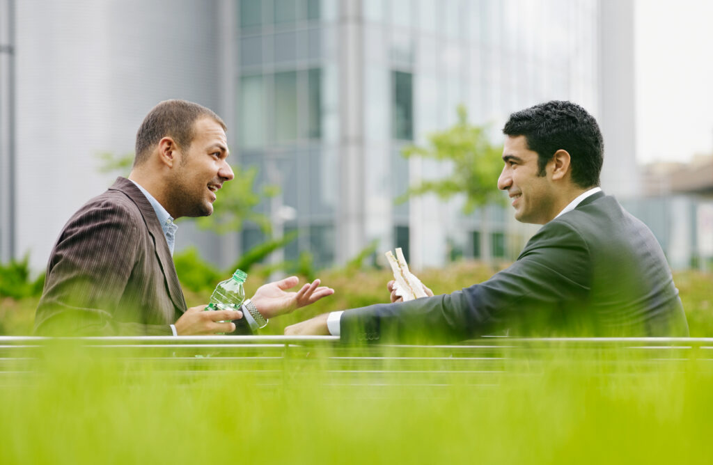 Two people having a discussion over lunch